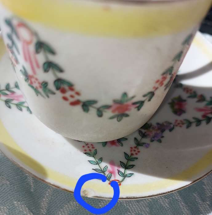 A COLLECTION OF HAND PAINTED TEA CUPS AND SAUCERS