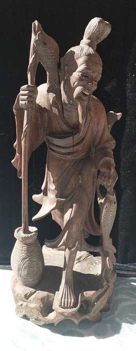 AN ANTIQUE CHINESE CARP FISHERMAN STATUE