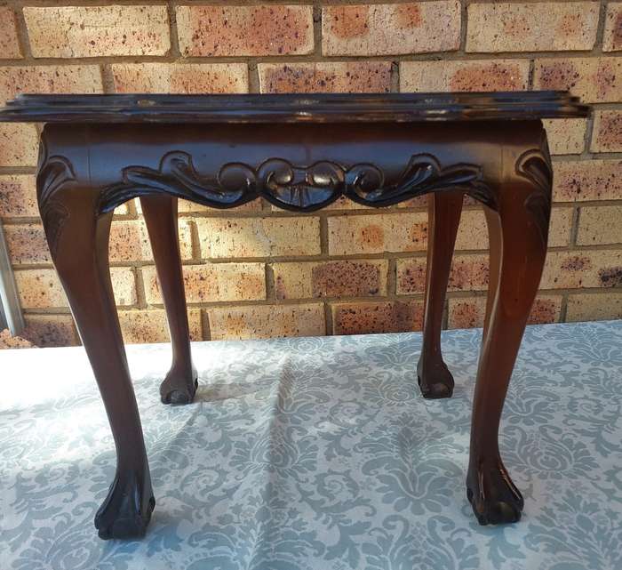AN ANTIQUE RECTANGULAR SOLID WOOD BALL N CLAW LEGGED OCCASIONAL TABLE