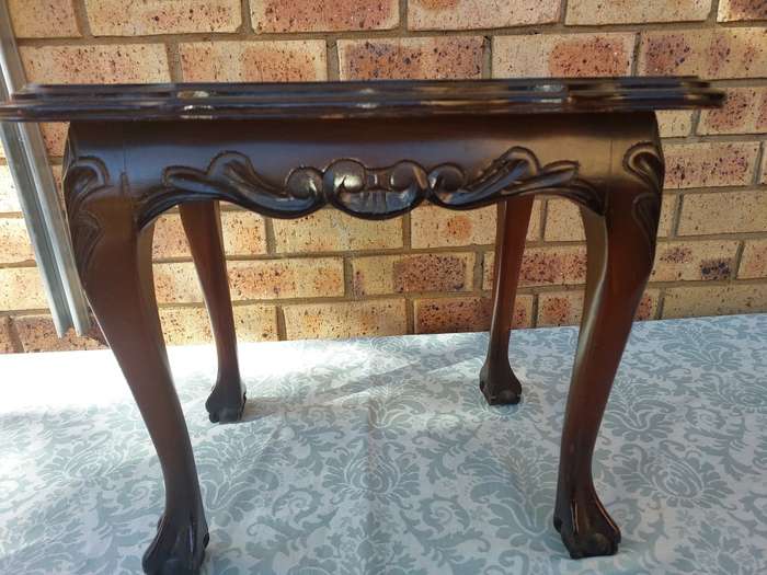 AN ANTIQUE RECTANGULAR SOLID WOOD BALL N CLAW LEGGED OCCASIONAL TABLE