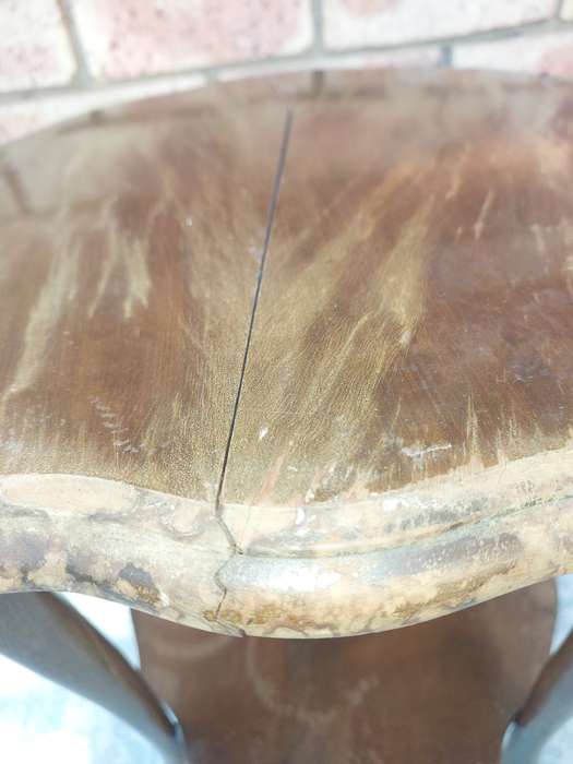 AN ANTIQUE SOLID WOOD TWO TEAR TEA TABLE WITH BALL N CLAW LEGS