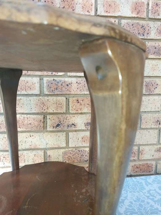 AN ANTIQUE SOLID WOOD TWO TEAR TEA TABLE WITH BALL N CLAW LEGS