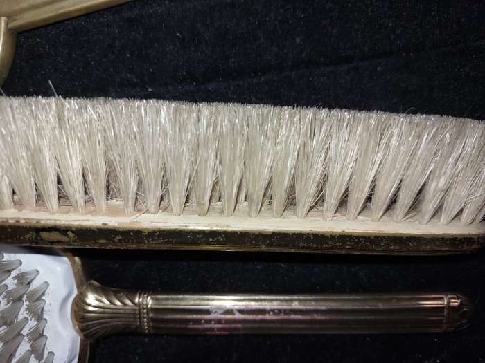 AN ANTIQUE COLLECTION EDWARDIAN BRASS GOLD PLATED HAIR BRUSHES
