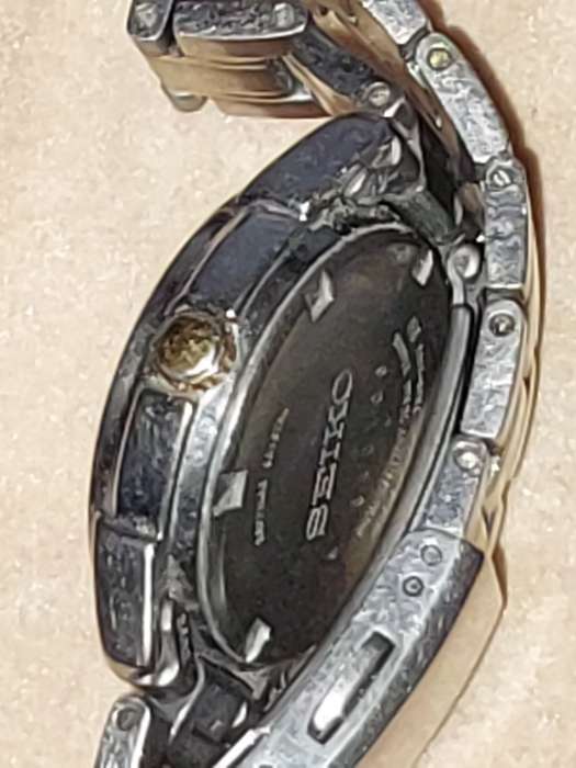 A VINTAGE SEIKO LADYS SAFFIRE CRYSTAL DATE  TITANIUM