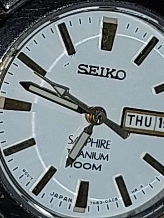 A VINTAGE SEIKO LADYS SAFFIRE CRYSTAL DATE  TITANIUM