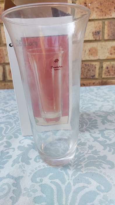 A RHAPSODY GLASS VASE SOLD AS IS