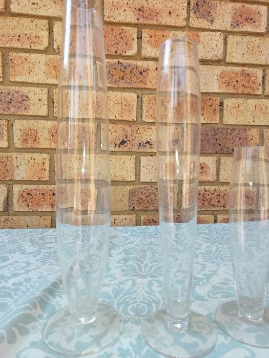 A COLLECTION OF THREE ART DECOR FLUTED GLASS VASES