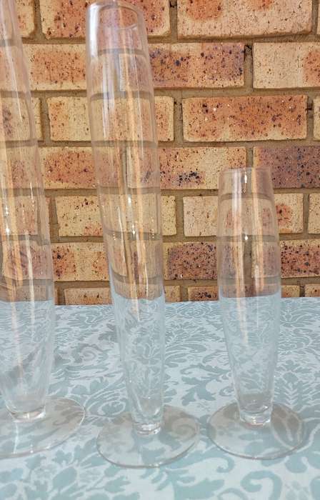 A COLLECTION OF THREE ART DECOR FLUTED GLASS VASES