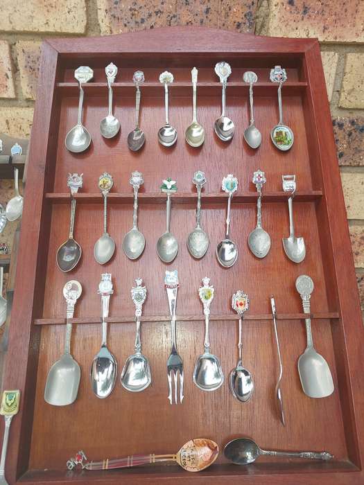 AN ENTIRE COLLECTION OF 108 MEMORABILIA SPOONS AND CABINETS