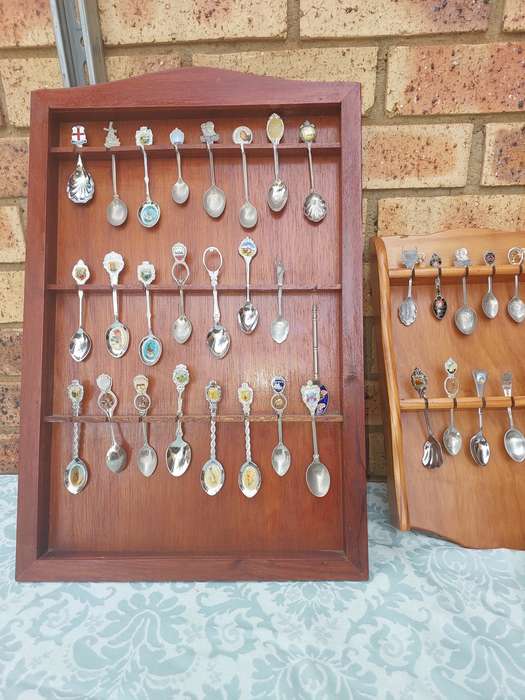 AN ENTIRE COLLECTION OF 108 MEMORABILIA SPOONS AND CABINETS