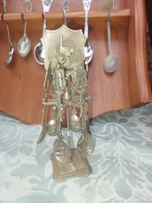 AN ENTIRE COLLECTION OF 108 MEMORABILIA SPOONS AND CABINETS