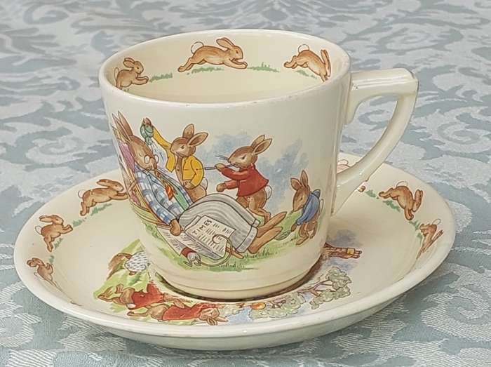A RARE ROYAL DOULTON BUNNYKINS TEA CUP AND SAUCER