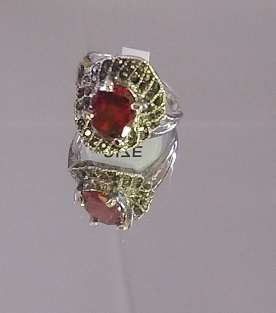 RUBY AND GARNET SIMULANTS SET IN ANTIQUE SILVER RING