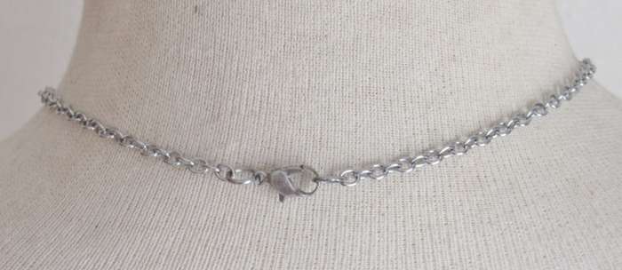 Vintage silver tone chain with tube pendant filled with jade chips