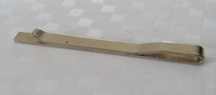 Vintage gold tone tie bar with engraved design