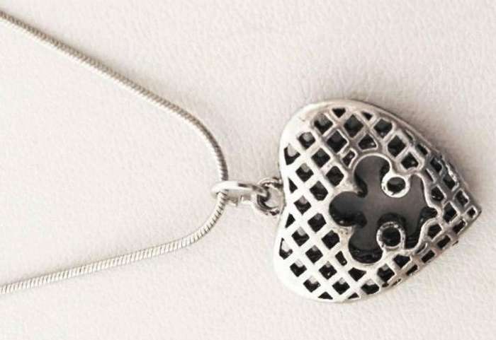 Silver tone heart pendant on a chain