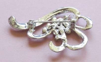 Silver tone and clear stone brooch