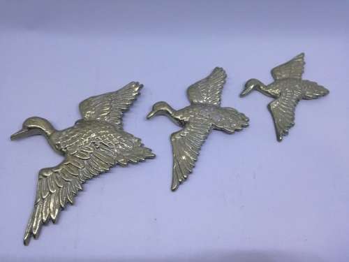 Solid brass flying ducks