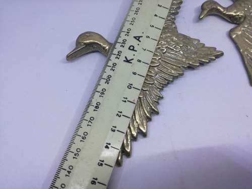 Solid brass flying ducks