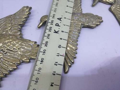 Solid brass flying ducks