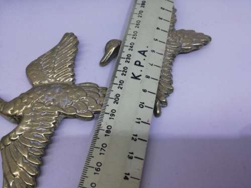 Solid brass flying ducks