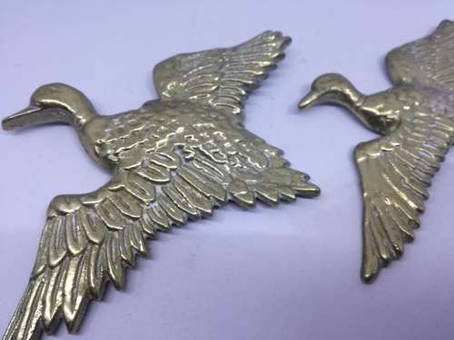 Solid brass flying ducks