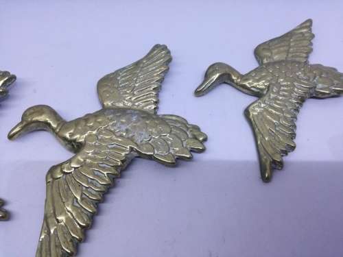 Solid brass flying ducks