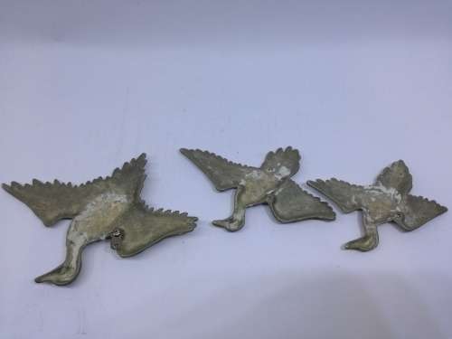 Solid brass flying ducks