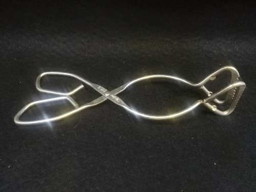 Vintage skyline tongs made in England, stainless steel