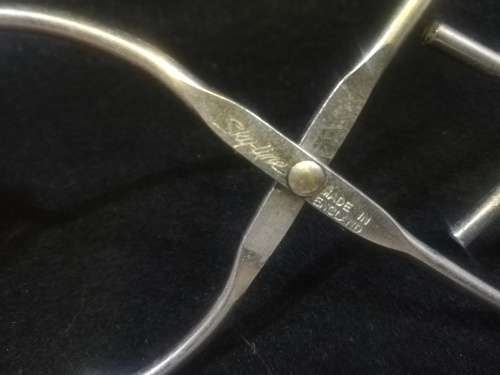 Vintage skyline tongs made in England, stainless steel