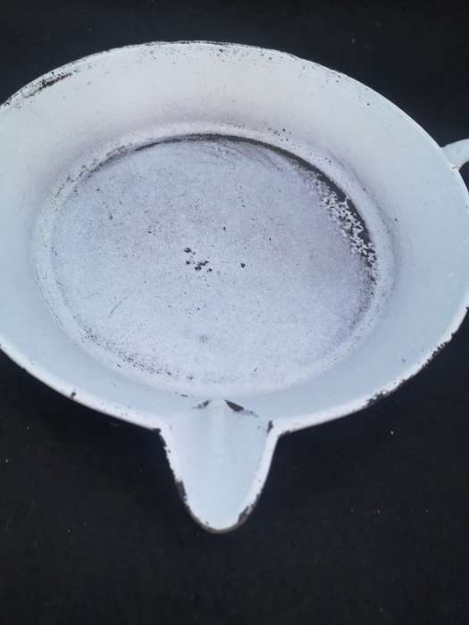 Heavy cast iron pan with spout