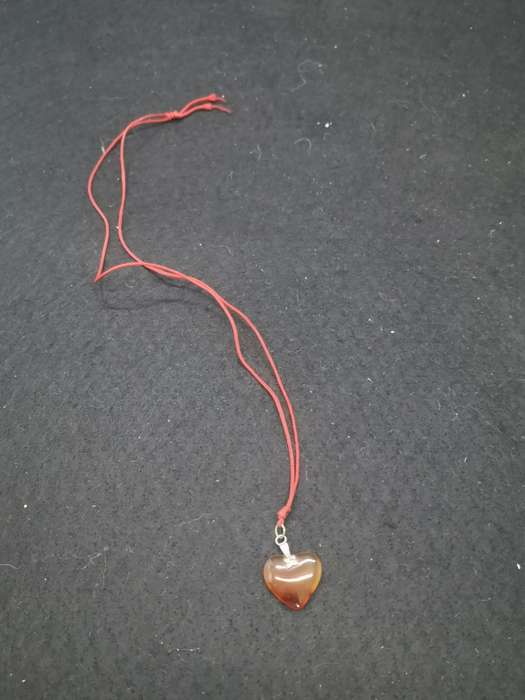Semi-precious stone heart pendant on a string
