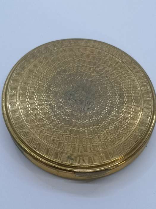 Powder compact