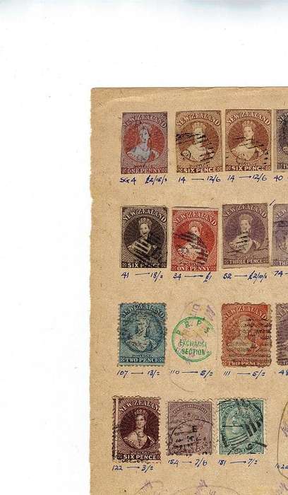 Rare Find 16 New Zealand very first used stamps hinged on page