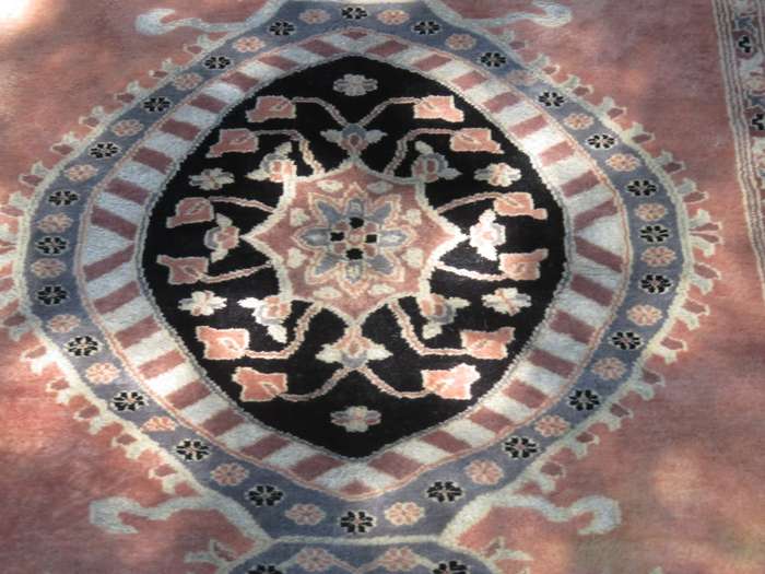 A hand knotted Jaipuri rug