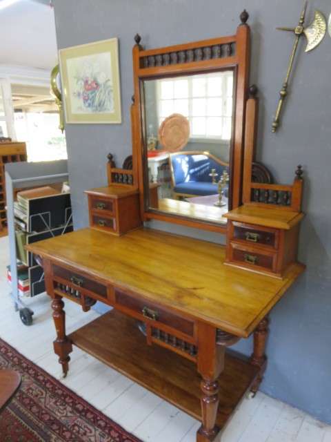 Early 20th century blonde mahogany two tier dressing table with a swing mirror.