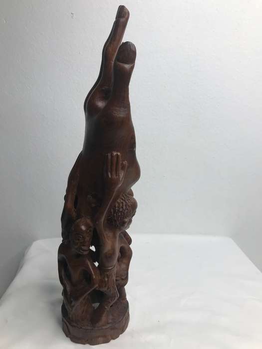 Wood Art Hand Carved Sculpture in Ebony one Piece Family holding up a Hand 35cm x 10cm