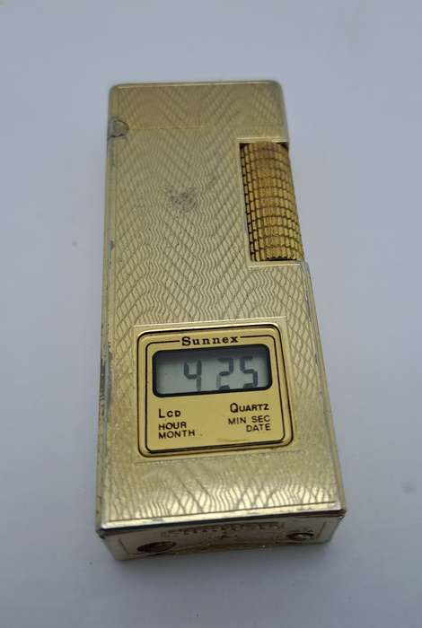 Vintage Sunnex lighter.. with Quartz Clock (Clock working) Lighter Not tested- made in Korea