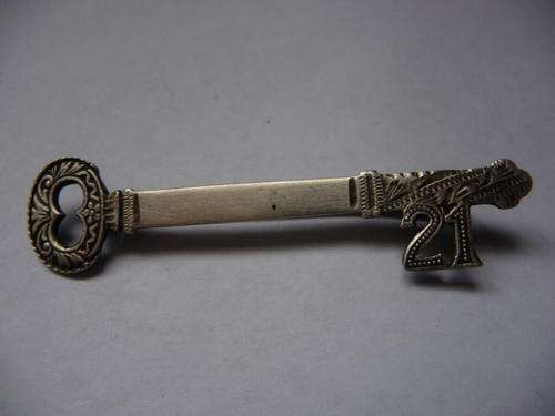 Antique Silver 21 Key Brooch