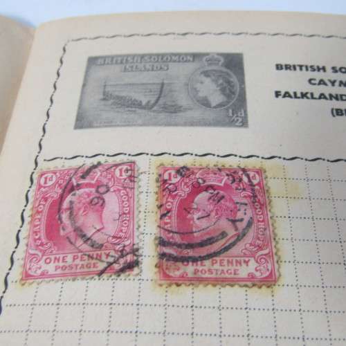 Old stamp album with over 300 stamps - some loose