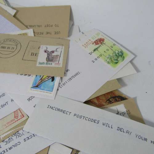 Many hundreds of stamps and postmarks on cover - unchecked