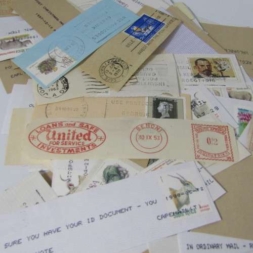 Many hundreds of stamps and postmarks on cover - unchecked
