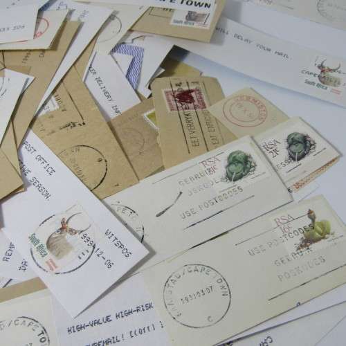Many hundreds of stamps and postmarks on cover - unchecked