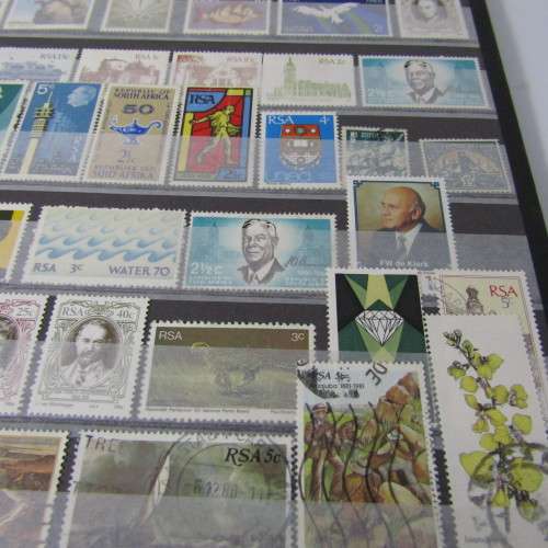 12 Page stamp album with over 500 world stamps