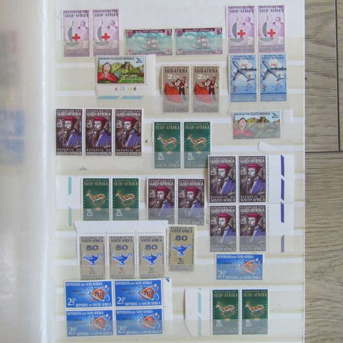 Stamp album with about 850 stamps - most in blocks or control blocks - some early ones