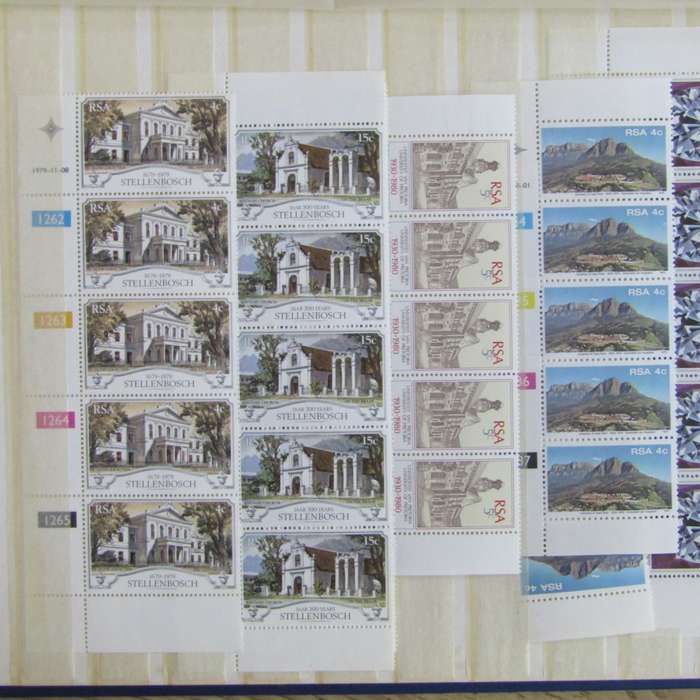 Stamp album with about 850 stamps - most in blocks or control blocks - some early ones