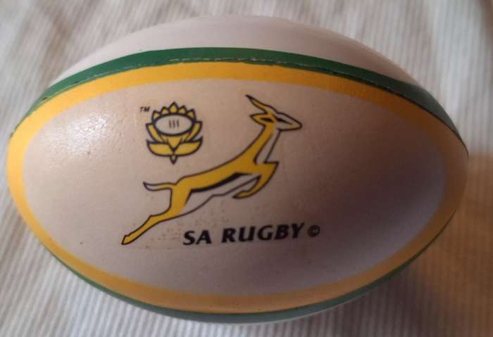 Rugby Shaped Stress ball with S.A. Rugby and Wellington VO Brandy