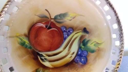 Vintage pierced rim display plate with painted fruit on.