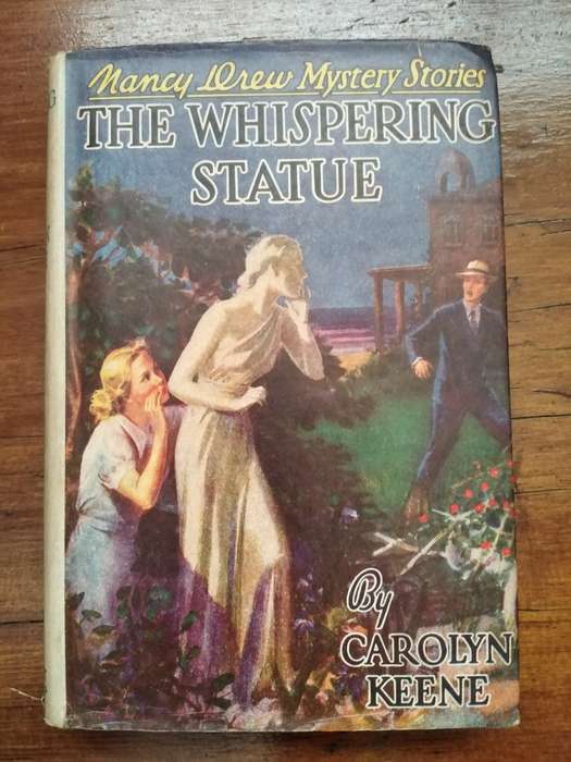 The Whispering Statue - Carolyn Keene. Nancy Drew - 1937 217 pages Some damage to Jacket MerlinsArro