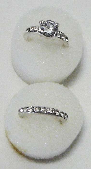 A Pair of Silver Coloured Rings set with Diamantes